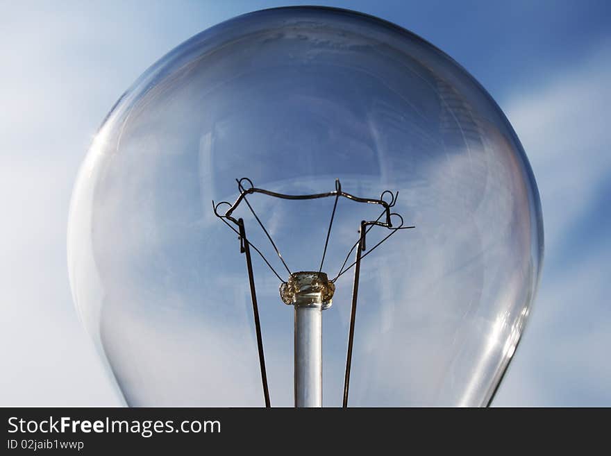 Bulb on a background of the dark blue sky