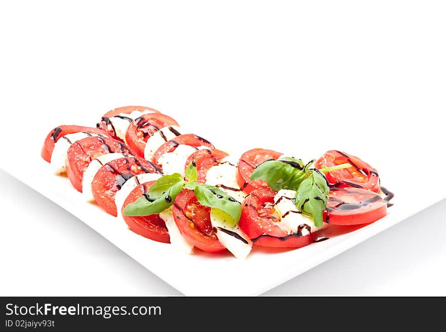 Fresh tomatoes with mozzarella and basil. Fresh tomatoes with mozzarella and basil