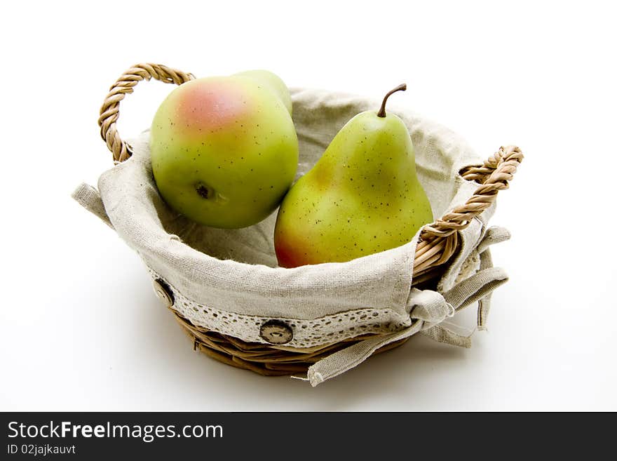 Pears in the basket and onto white background