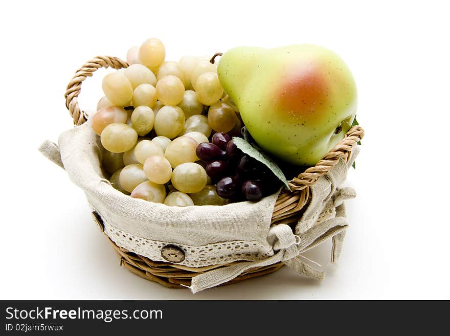 Fresh fruit in the basket onto white background