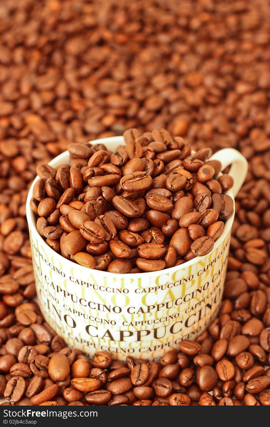 Coffee beans in a cappuccino cup