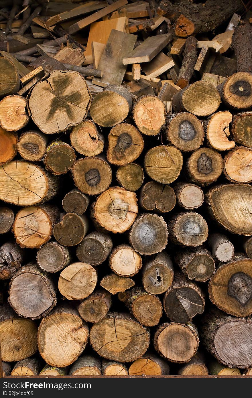 Closeup Of Some Piled Old Wood Stumps Background. Closeup Of Some Piled Old Wood Stumps Background