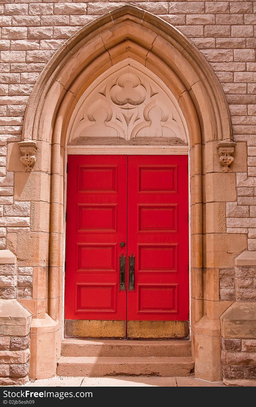 Image of red door on the front of a church. Image of red door on the front of a church