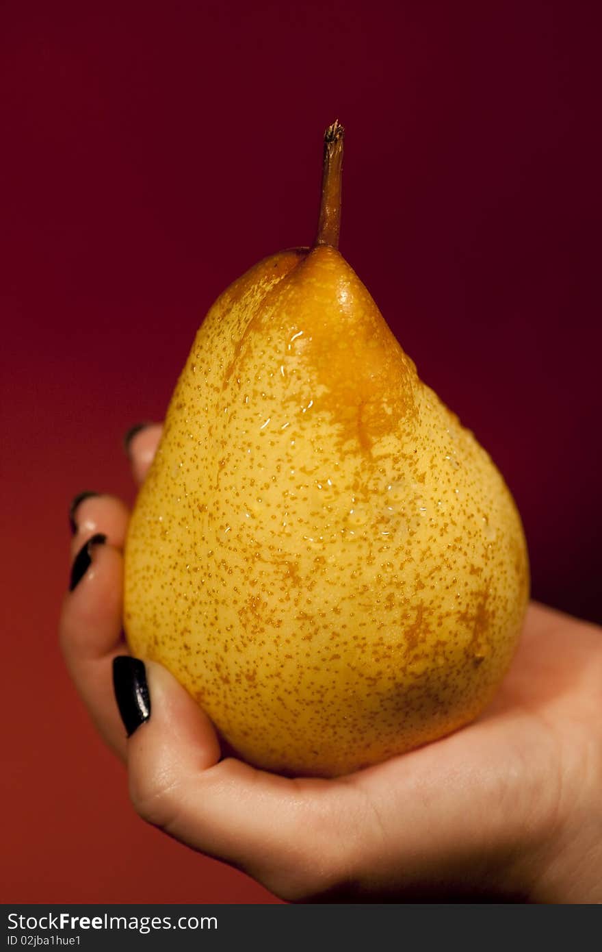 Holding a pear