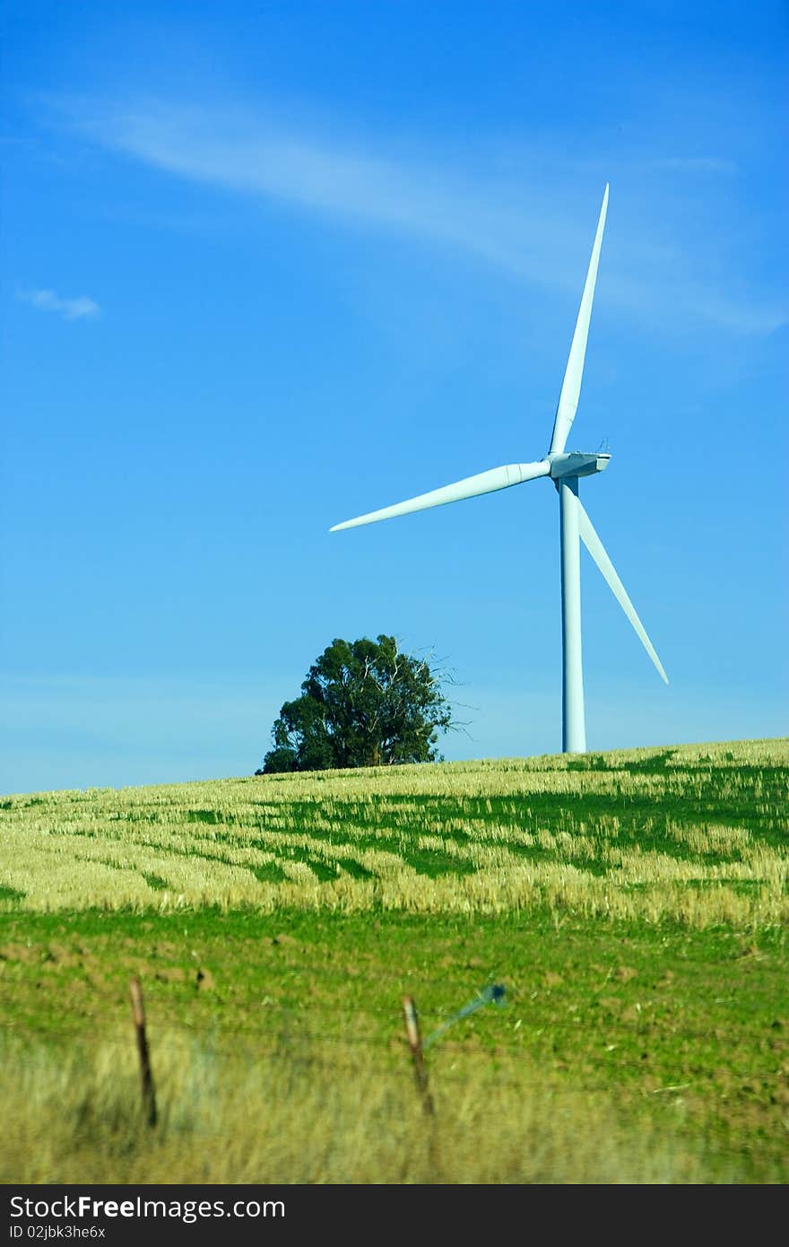 A turbin in a field at wind farm