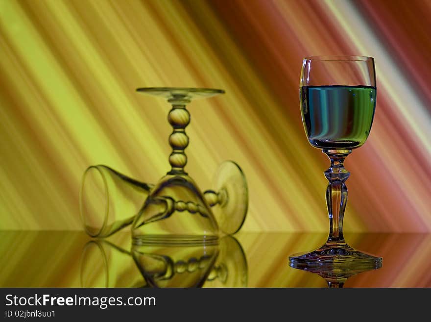 Three glasses on abstract yellow and red background. Three glasses on abstract yellow and red background