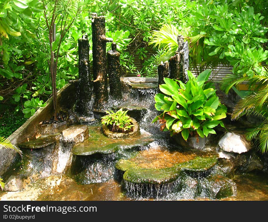 Waterfalls in the garden with plants. Waterfalls in the garden with plants.