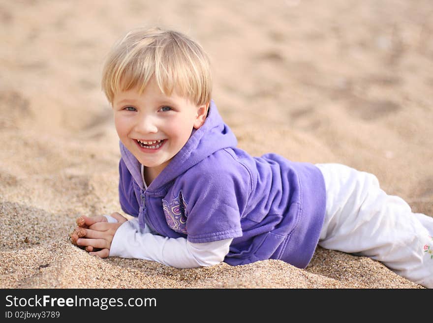 Smiling baby girl on the beach. Smiling baby girl on the beach