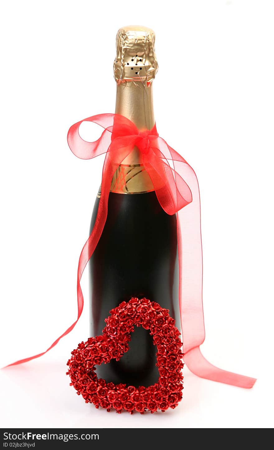 Champagne and heart on a white background