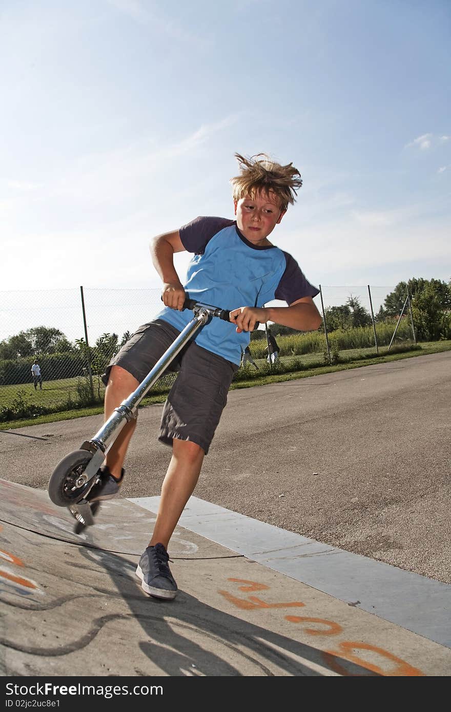 Boy is jumping with scooter in pipe. Boy is jumping with scooter in pipe