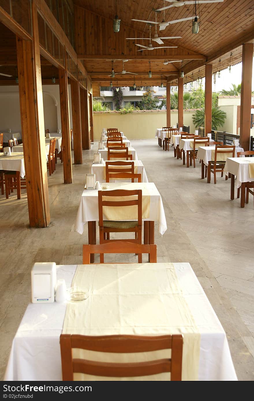 Little tables on a verandah in empty cafe. Little tables on a verandah in empty cafe