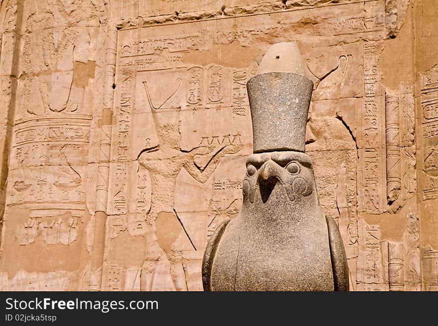 Ancient stone statue in Egyptian temple, incarnation of Pharaoh