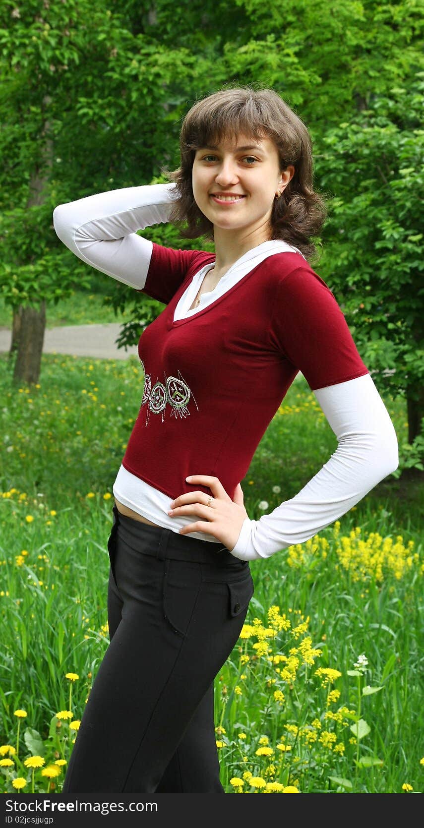 Pretty girl standing in the park, softlight