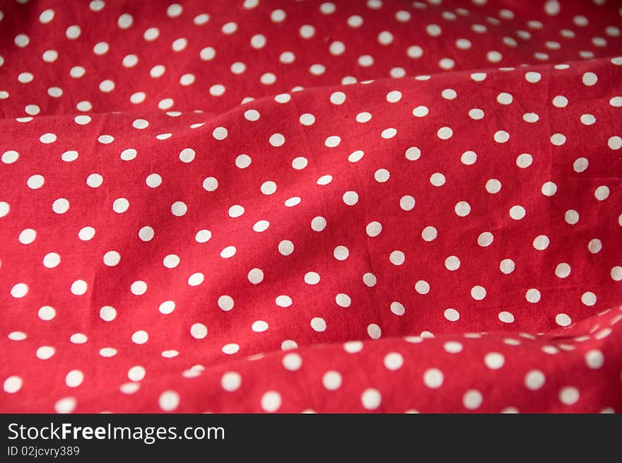 Red textile with white dots. Red textile with white dots