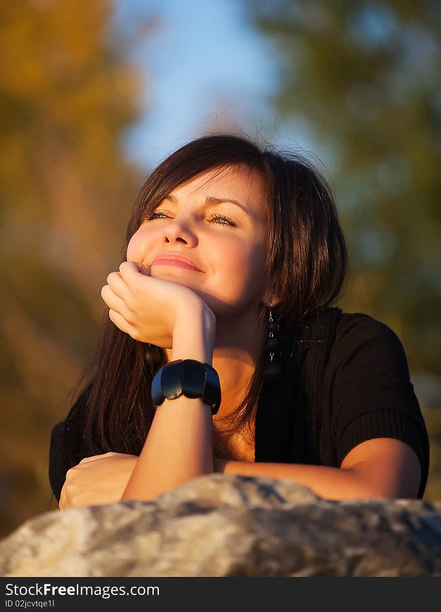 Bright photo of a beautiful model relaxing on a beach