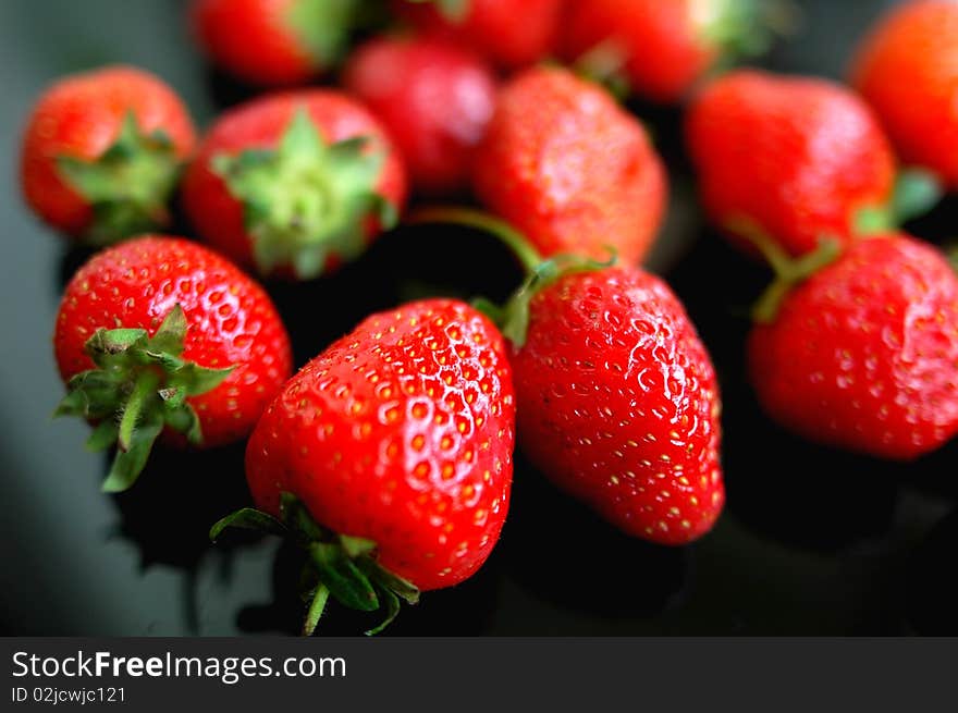 Fresh red strawberry isolated on a blurred background