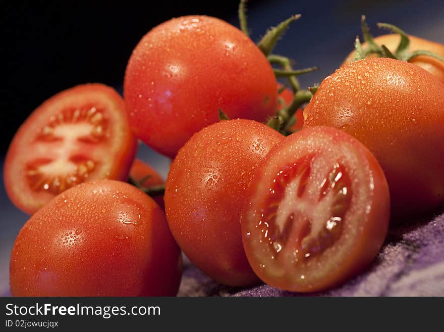 Close view of a slice of tomatoes fruits on top of the table. Close view of a slice of tomatoes fruits on top of the table.