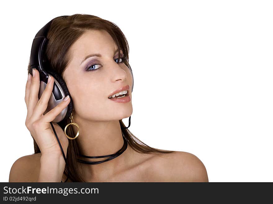 Beautiful brunette woman wearing headphones and listening to music. Beautiful brunette woman wearing headphones and listening to music