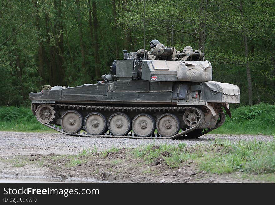 A British tank crew take a break during a training exercise