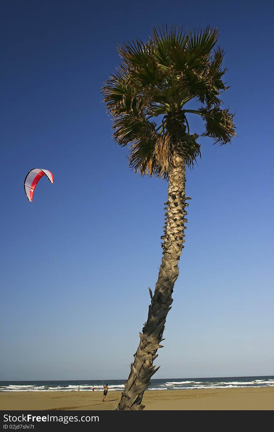 Kite surfing in the air, sea and beach in the Mediterranean