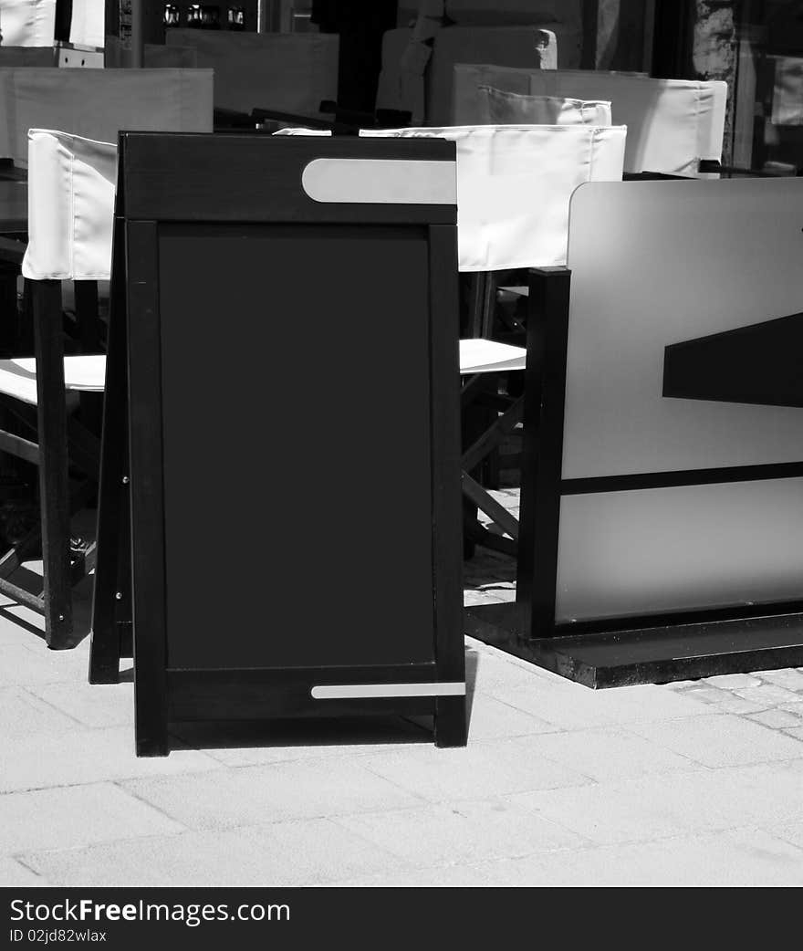 A blank blackboard in the street