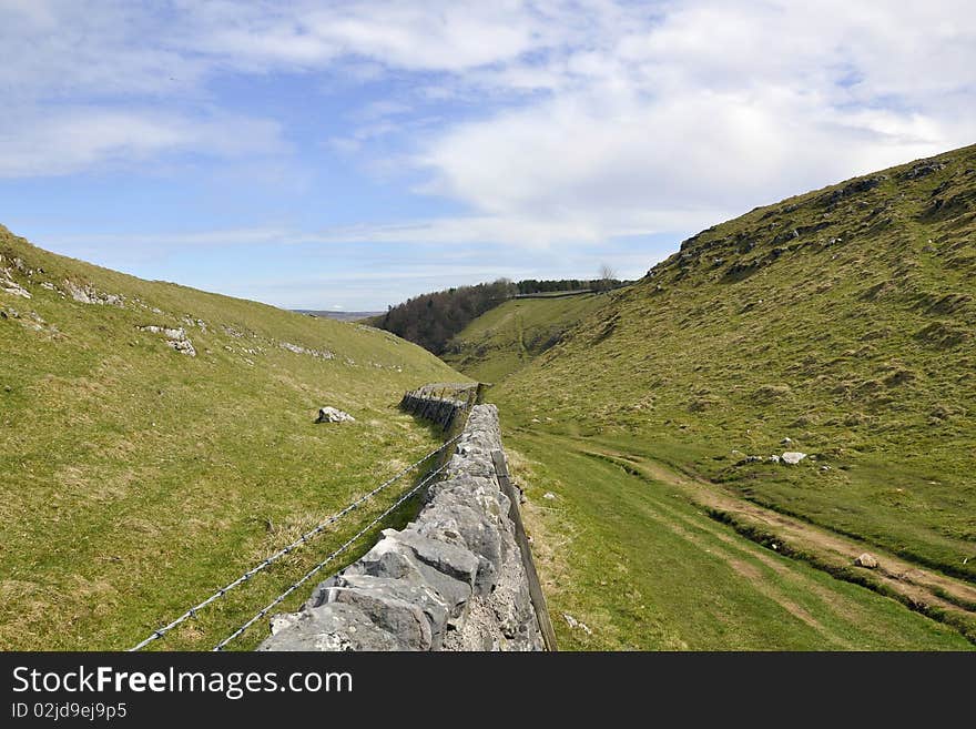 English countryside landscape including rocks, hills, grass, taken on a cloudy sunny day. English countryside landscape including rocks, hills, grass, taken on a cloudy sunny day.