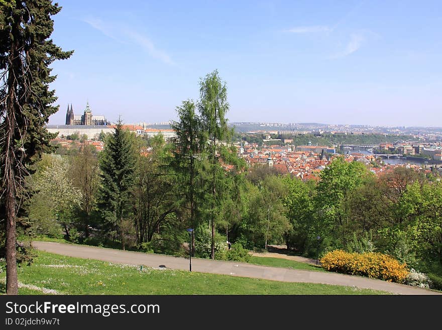 The panoramic View on spring Prague above River Vltava with gothic Castle