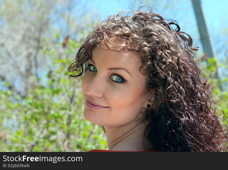 Portrait cute smiling lady on nature