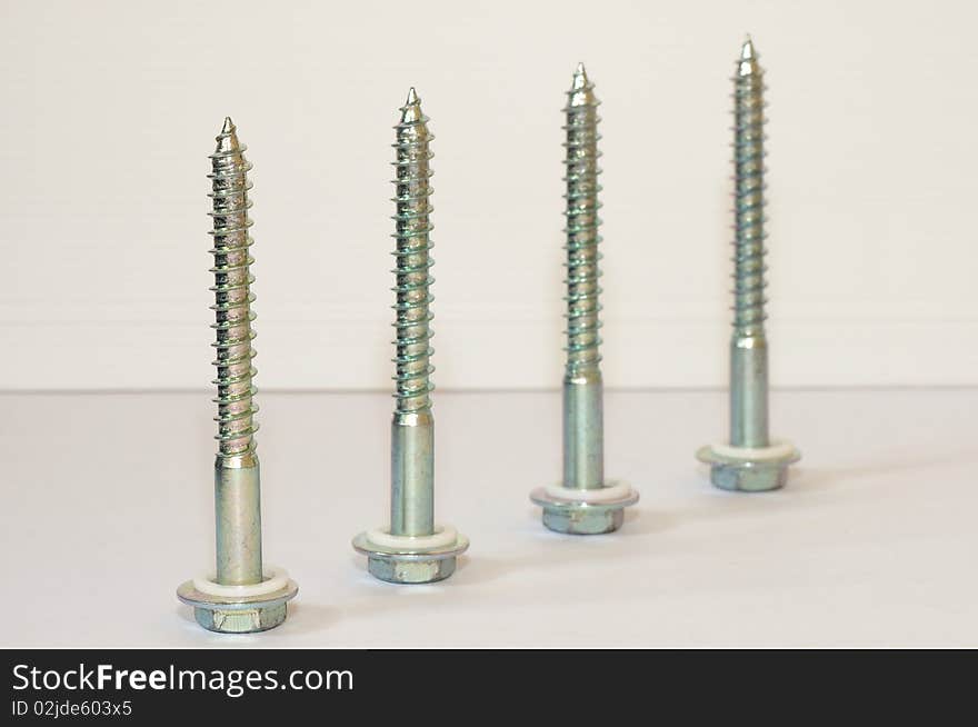 Four big silver hex head sharp-pointed cap screws. Four big silver hex head sharp-pointed cap screws.