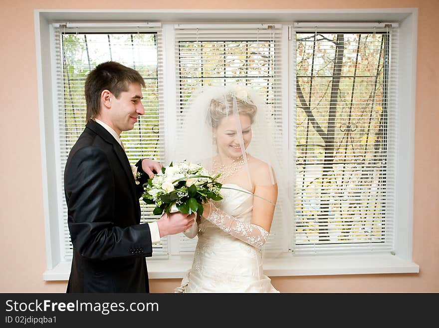 Bride And Groom With Flowers