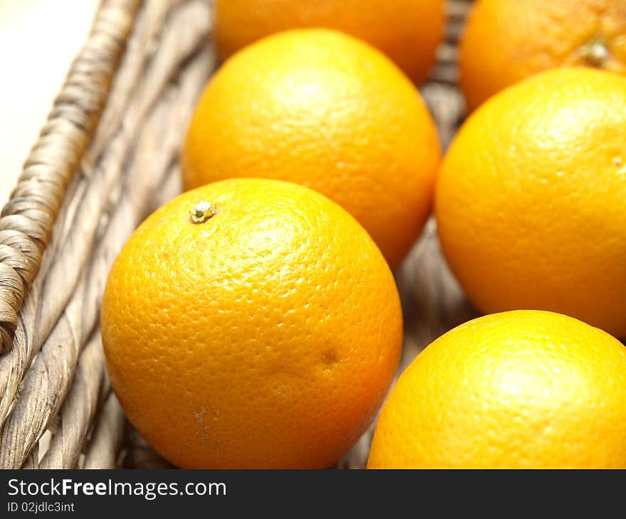 Some oranges in a basket