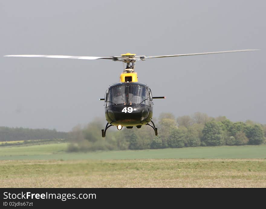 A squirrel helicopter against a field on Salisbury Plain. A squirrel helicopter against a field on Salisbury Plain