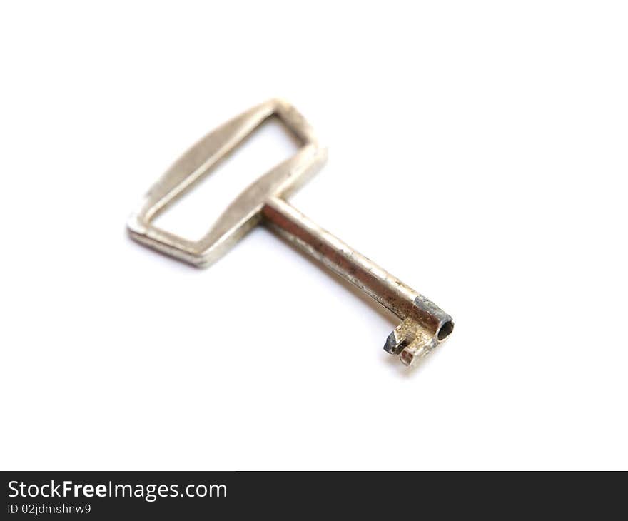 Metal key on white background