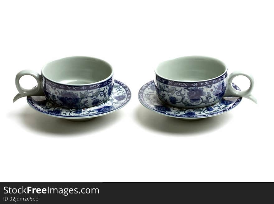 A pair of tea cups isolated on white background