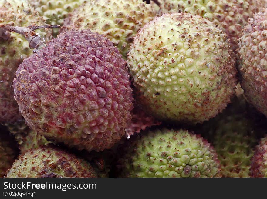 Close-up of fresh and tasty litchis background. Produced fruit in southern China.