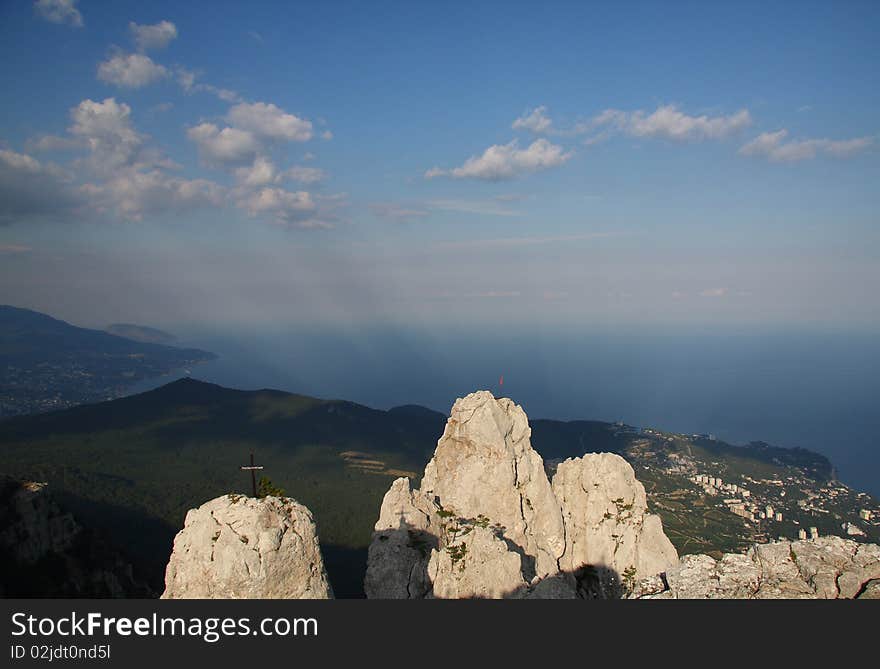 Mountains and sea under blue sky