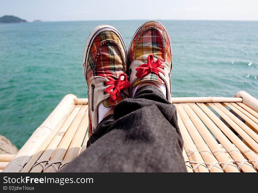 Retro styled sneakers in the sea. Retro styled sneakers in the sea.