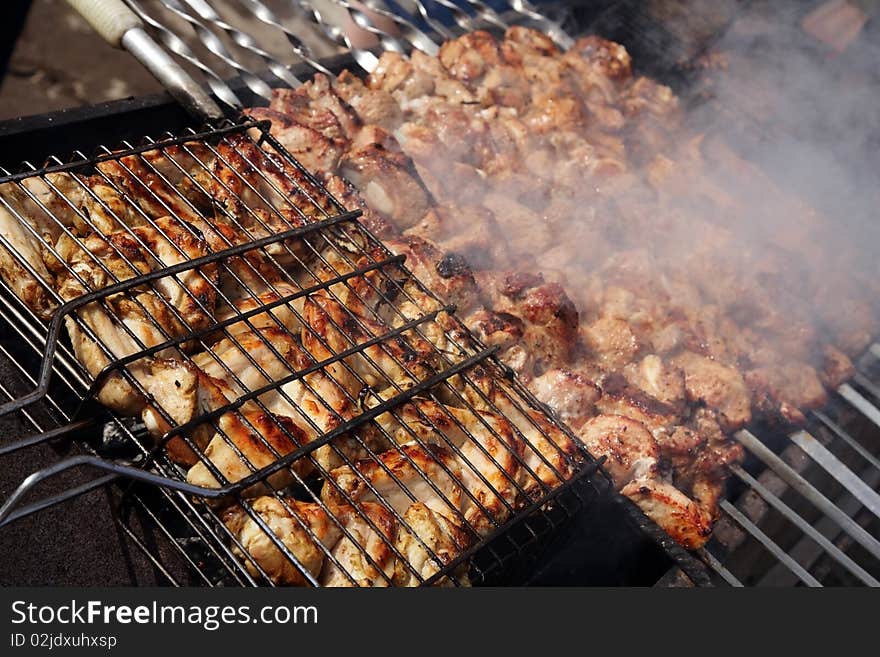 Outdoor cooking. Barbecue chicken and meat.