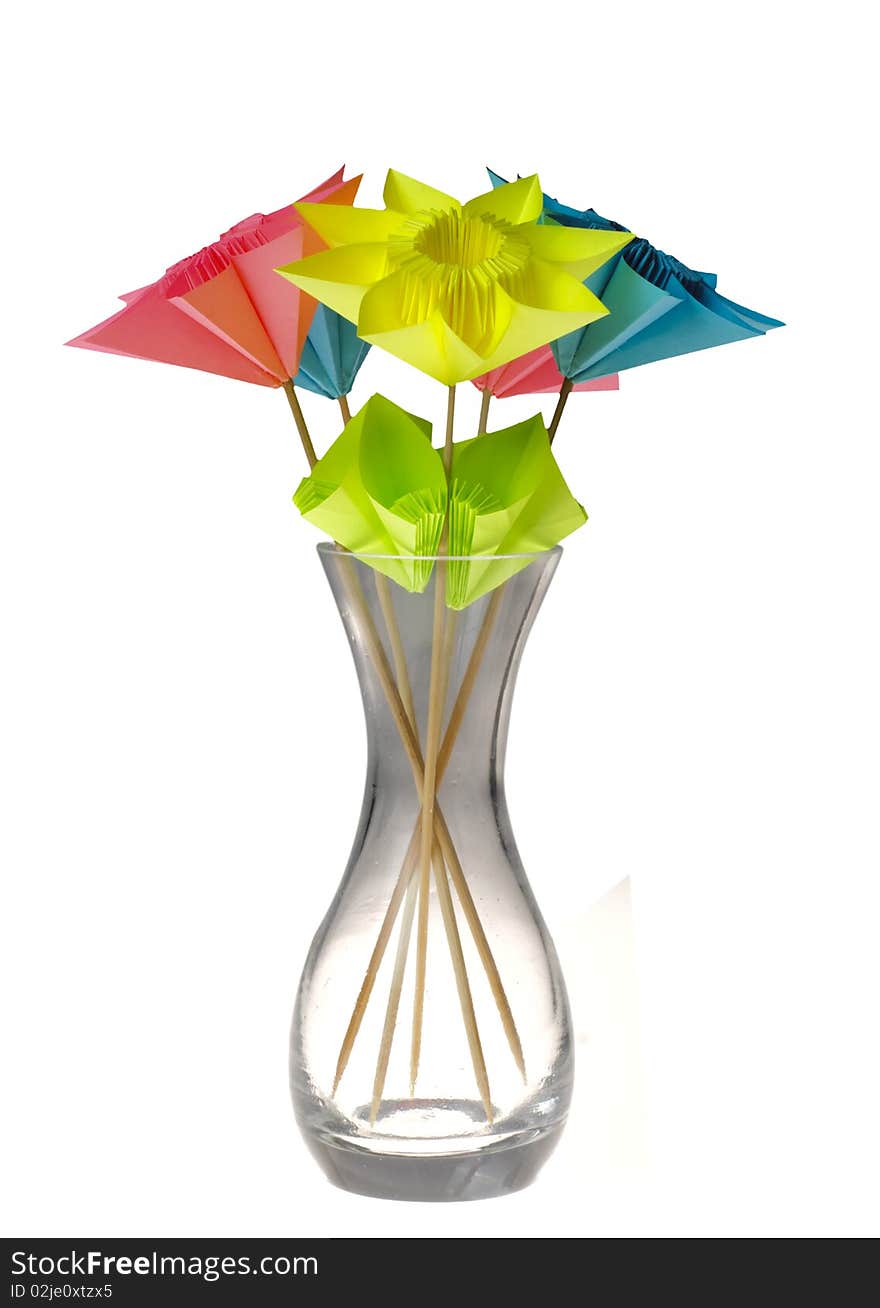 Origami flowers in glass vase