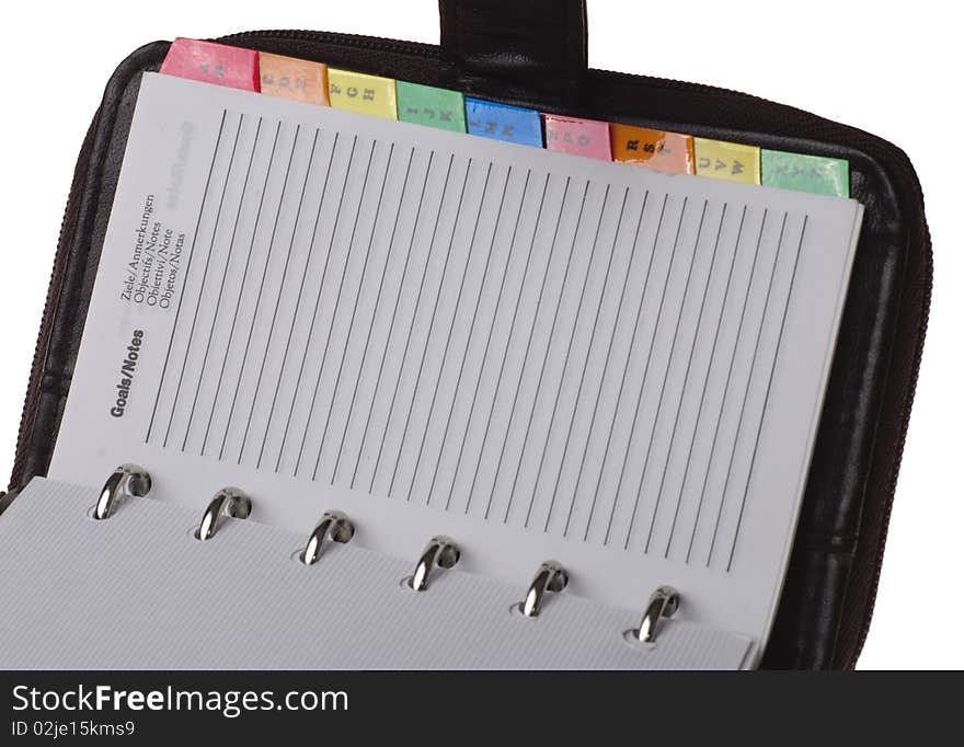 Diary and phone book in leather, isolated on white