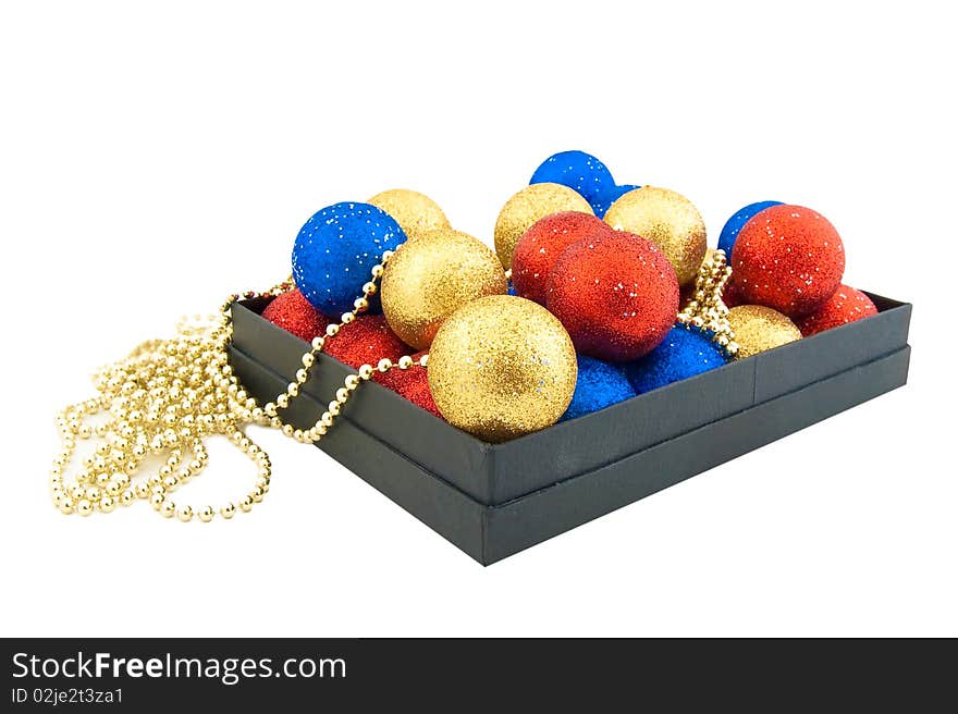 Set of blue,red and gold Christmas balls in a black box. Set of blue,red and gold Christmas balls in a black box