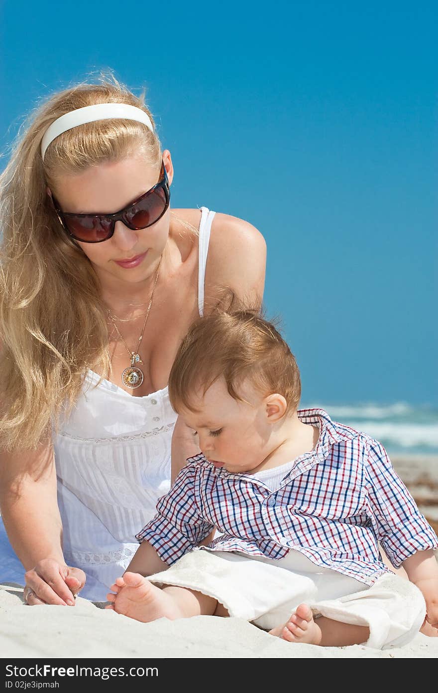 Child and mother on a beach. Child and mother on a beach