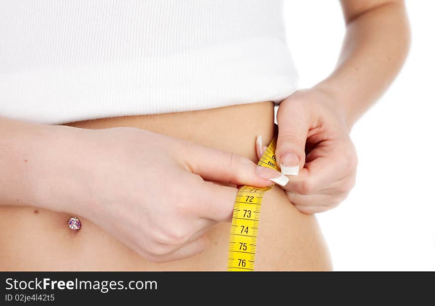 Young fitness girl on a diet - Measuring tape around a waist