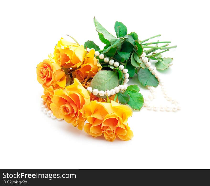 Bouquet of orange roses with a pearl necklace