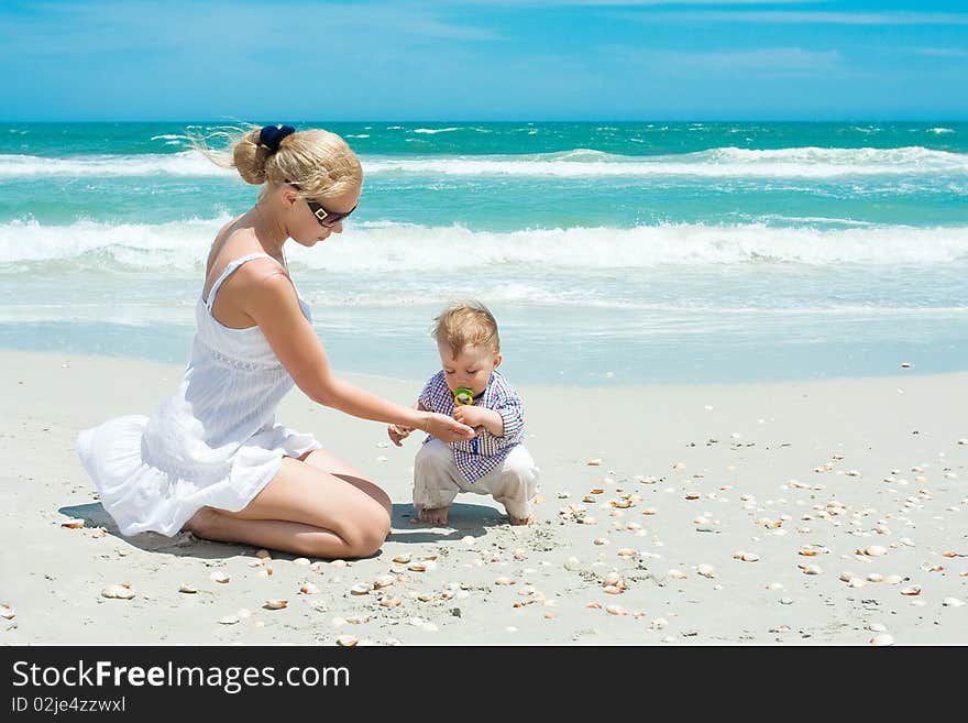 Baby with mother on a beach. Baby with mother on a beach