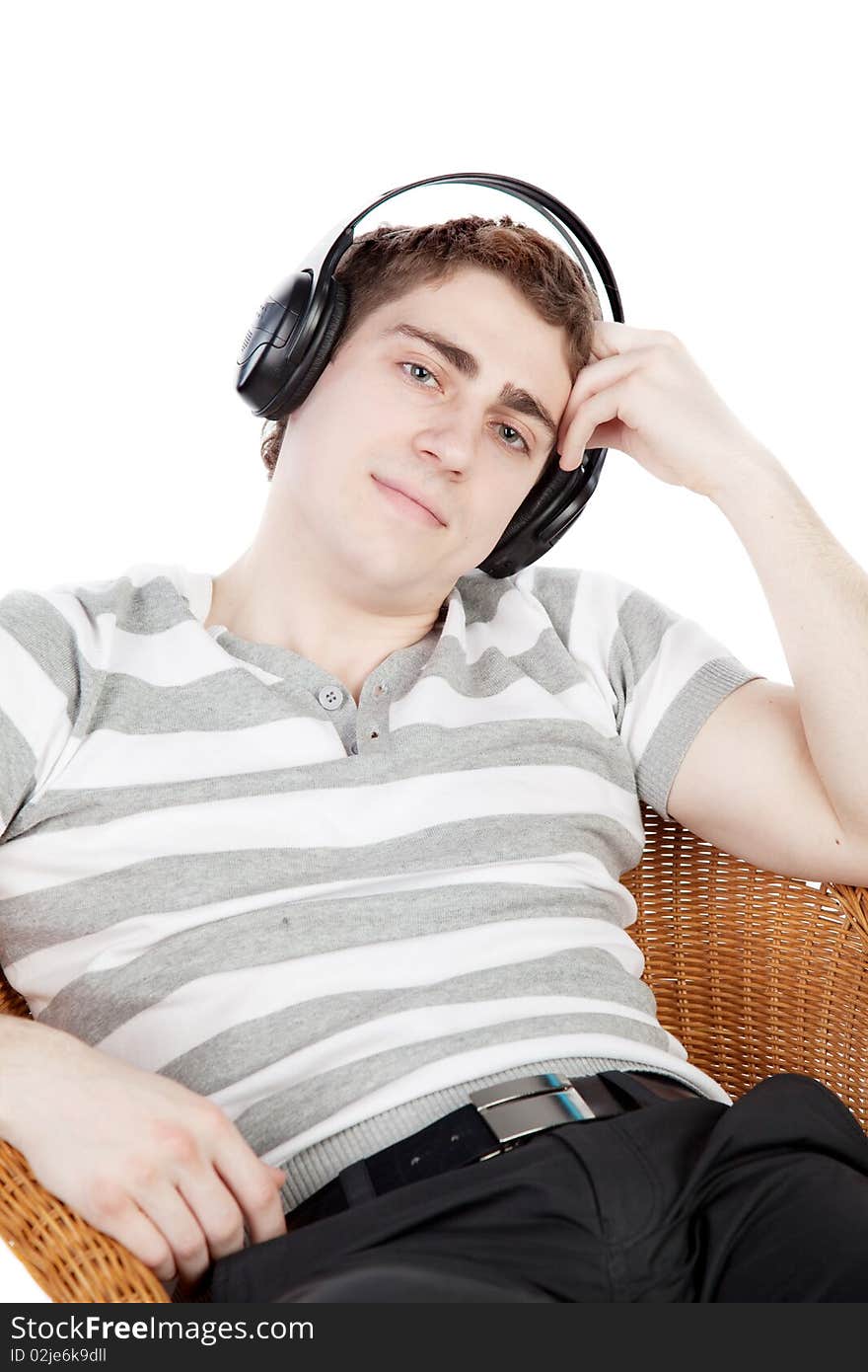 Young man is relaxing on armchair