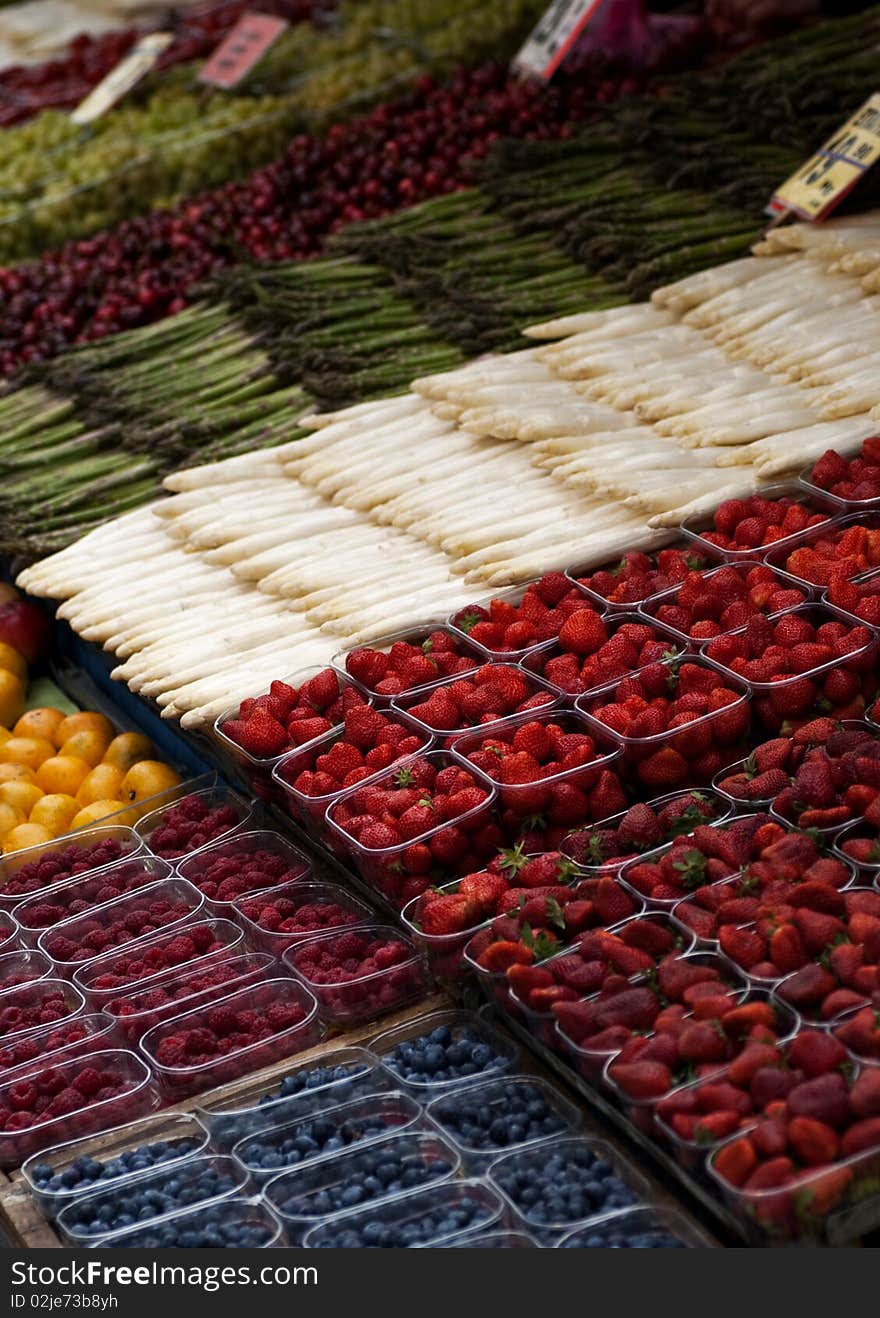 A stall at a street market selling fruits and vegetables