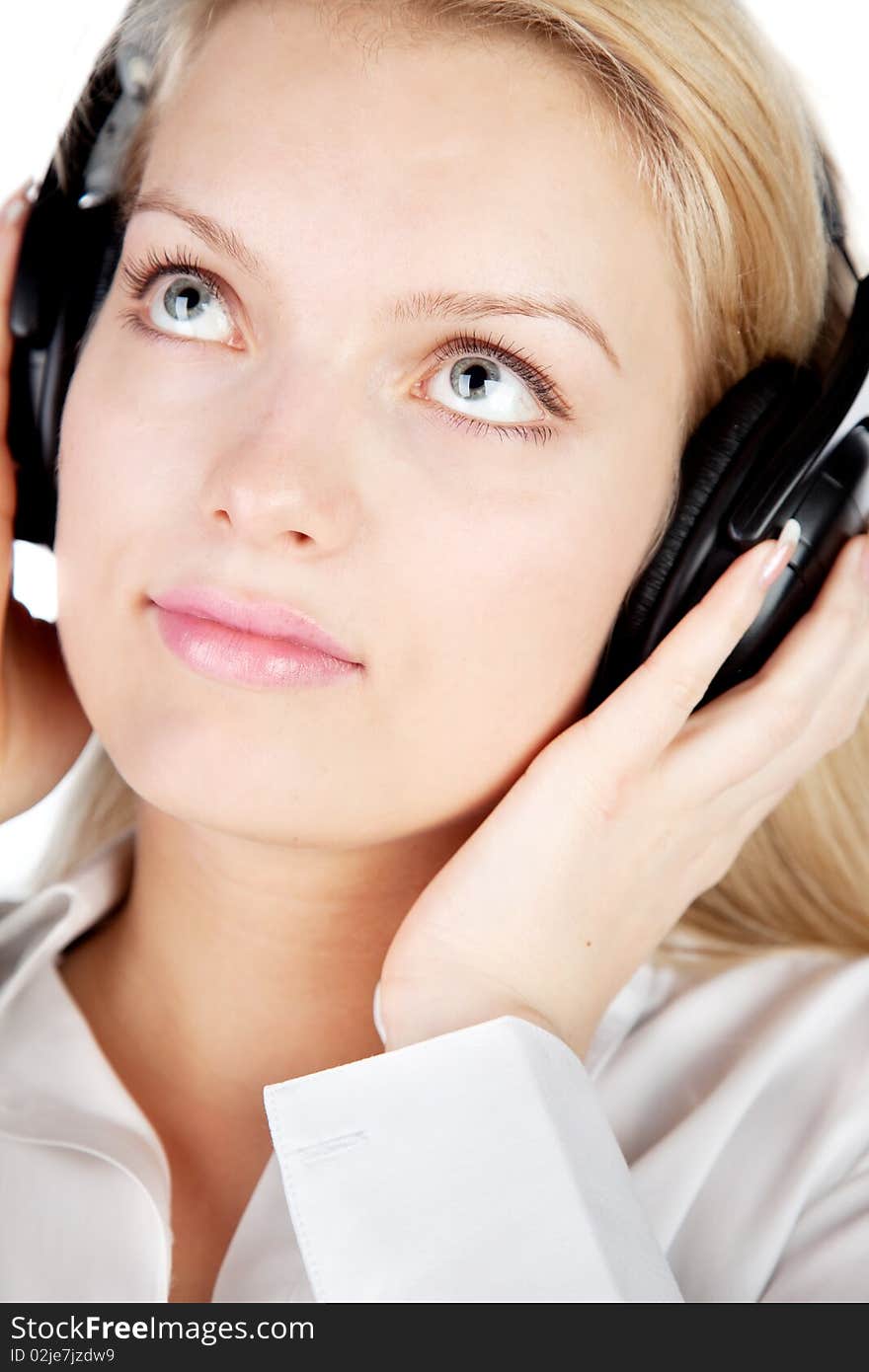 Young blonde with headphones isolated on white