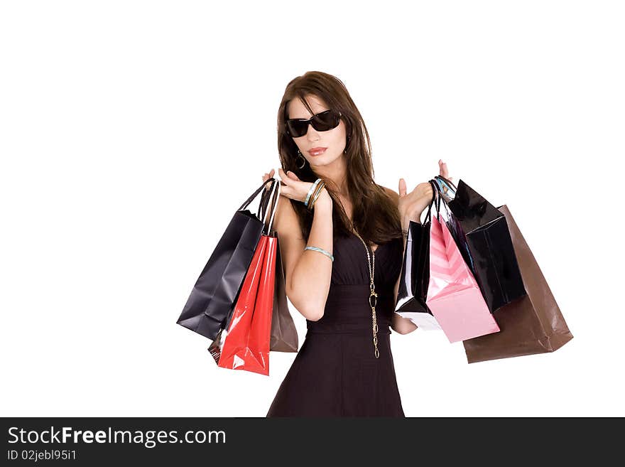 Brunette woman with sun glasses and lots of shopping bags. Brunette woman with sun glasses and lots of shopping bags