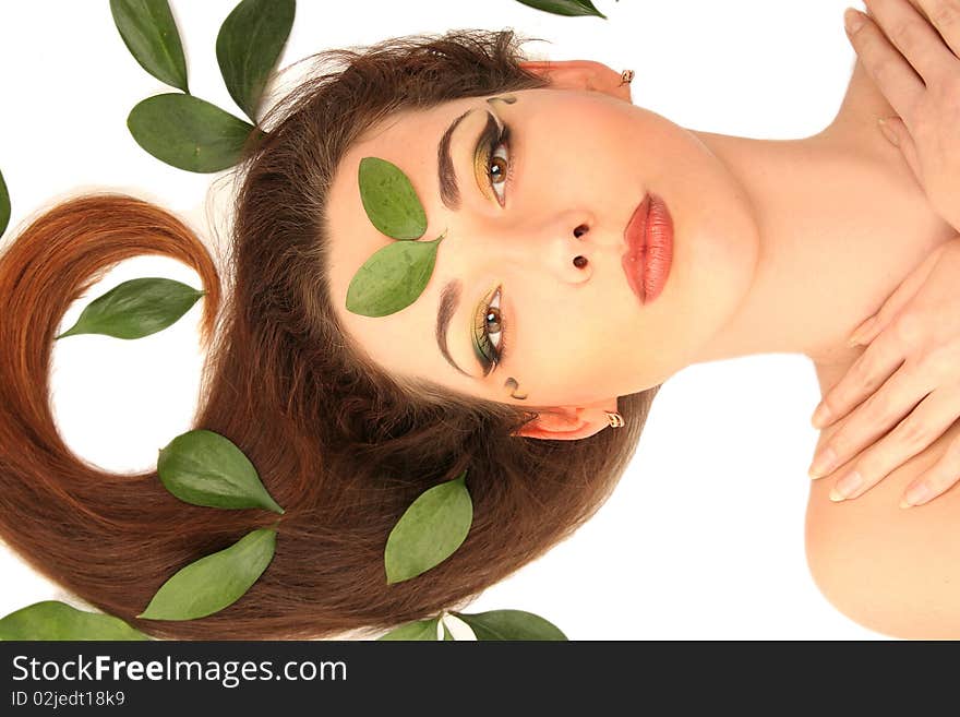 Beautiful young woman with green leaves. Beautiful young woman with green leaves